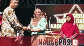 Foto. Kepala Puskesmas Pamolokan, Drg Novia Sri Wahyuni saat menerima penghargaan Juara I dalam Kegiatan Anugerah Inovasi Daerah dan Launching Event 2026